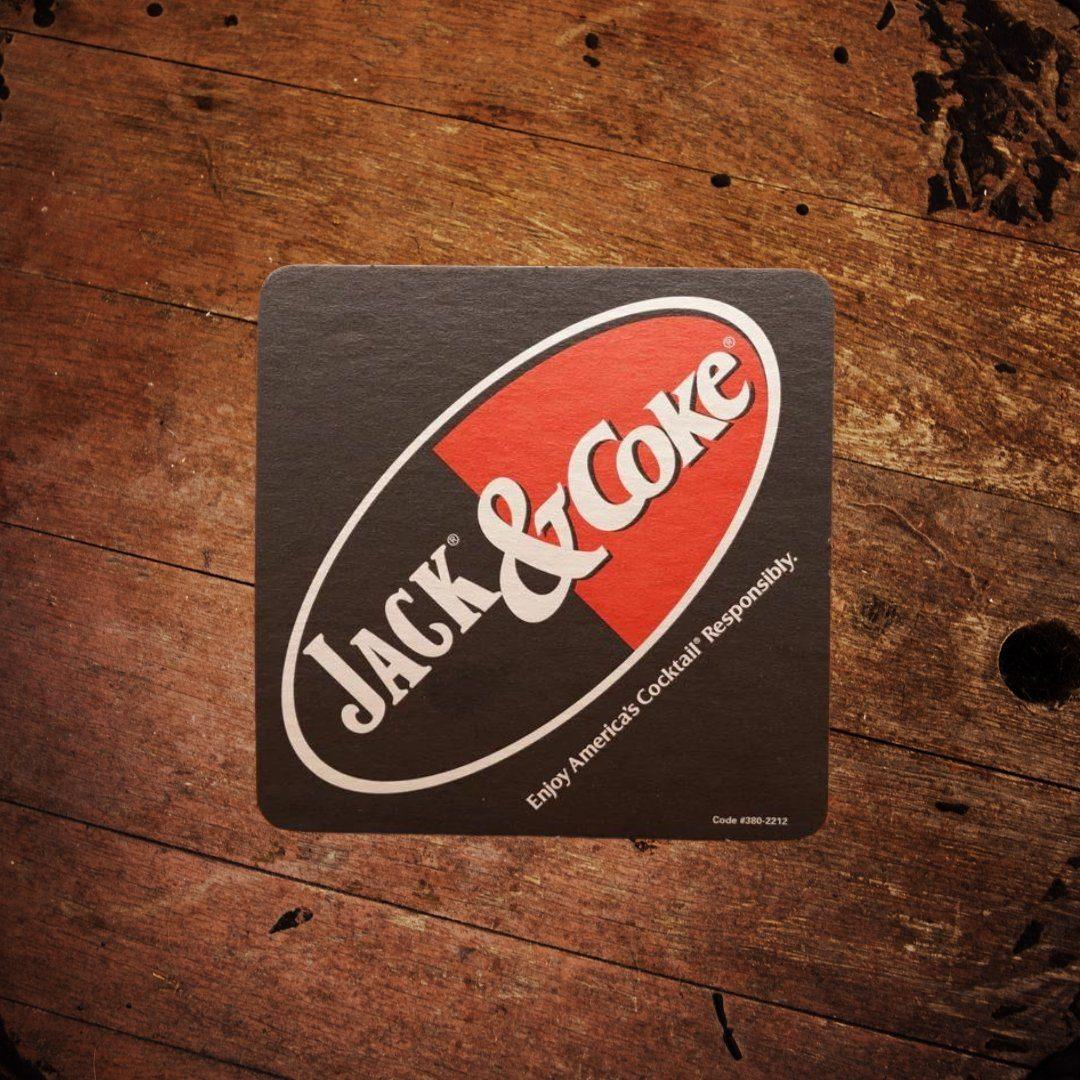 https://thewhiskeycave.com/cdn/shop/products/jack-daniels-and-coke-square-coaster-196591_1600x.jpg?v=1697438275